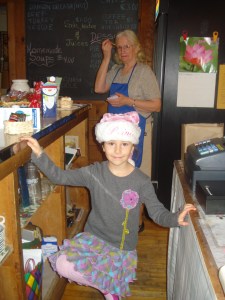 Kathy Lynds in the background & junior Tyson Ladies Aid member, Julia Baldwin, serving at Wilder House at the Coolidge Open House. Photo by Betty Aubin