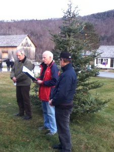 Plymouth Memory Tree Lighting by Michelle Pingree. Pieter Bowen (L), Al Poirier, & Robert Fishman - Memory Tree board members, reading names submitted for the Memory Tree list of remembrance.