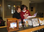 Shirley Billings and Cathy Lee looking at Gesine’s book